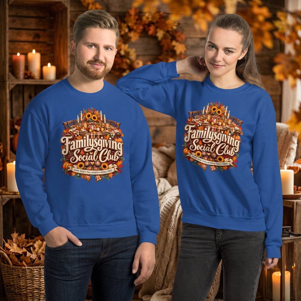 A man and a woman modeling matching royal blue crewneck sweatshirts with a large 'Familygiving Social Club' graphic on the front, set against a plain white background.