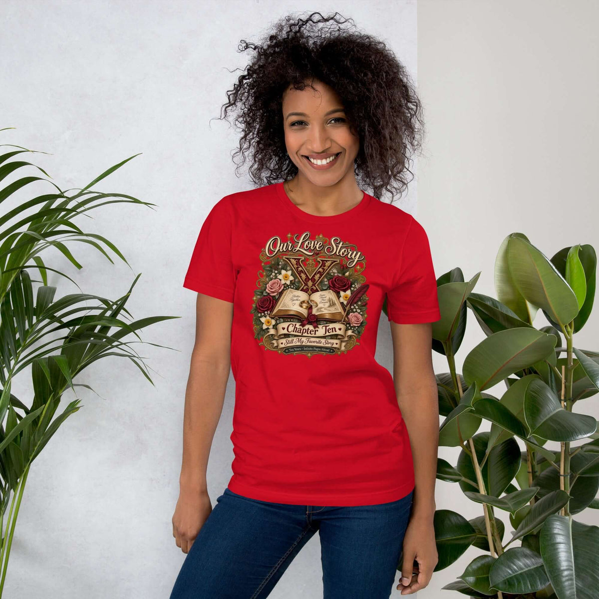 Model wearing a red Our Love Story Chapter Ten Anniversary T-Shirt, celebrating a decade of love.