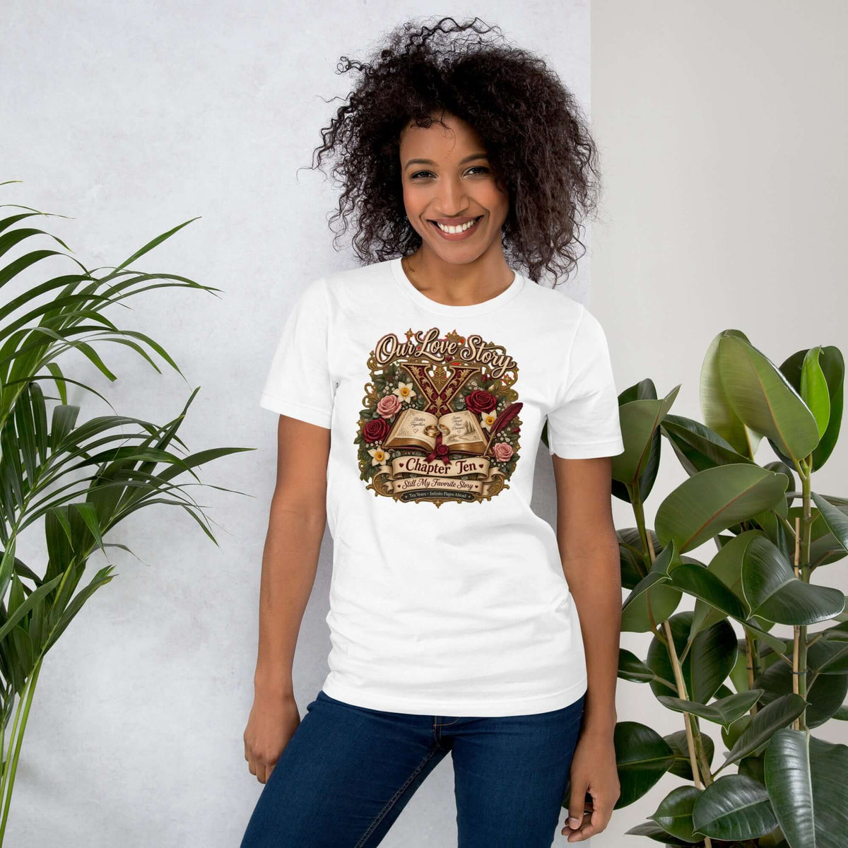 Smiling woman wearing a white 10th anniversary t-shirt featuring vintage design for Our Love Story Chapter Ten.